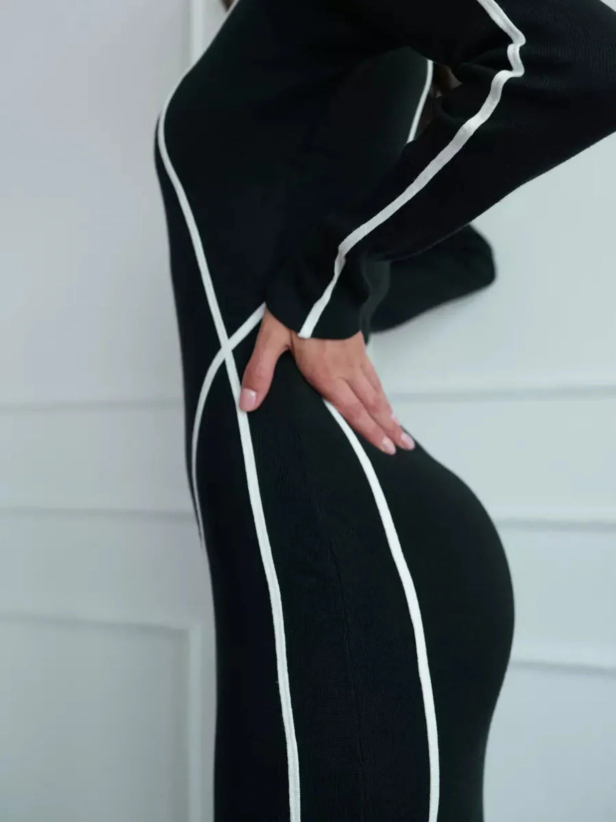 Midnight Curve Maxi Dress showcasing a sculpting silhouette with elegant white piping accentuating curves.