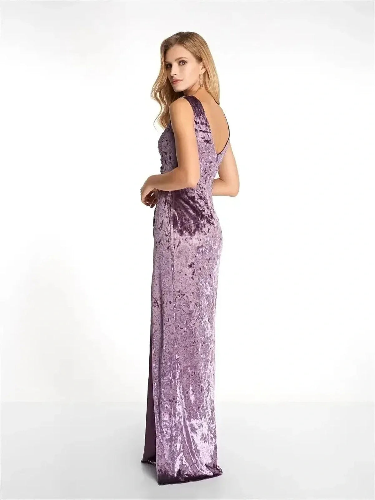 Elegant velvet maxi dress in soft lavender, showcasing sculpted fit and deep V-back for formal occasions.