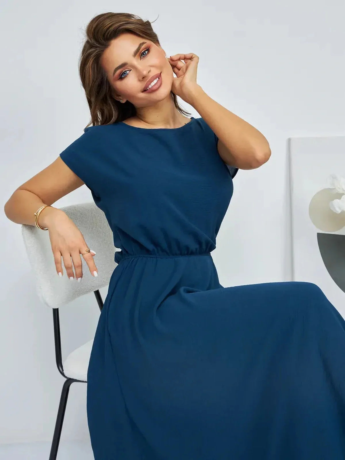 Verona Maxi Dress in deep blue, featuring a cinched waist and lightweight design, perfect for summer elegance.