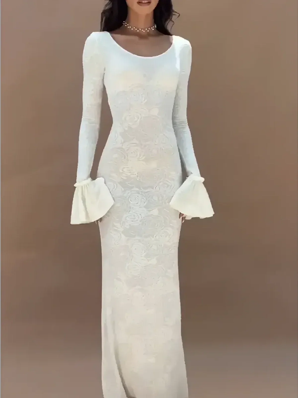 Floral Elegance Maxi Dress in white with flared bell sleeves and soft U-neckline, showcasing a feminine silhouette.