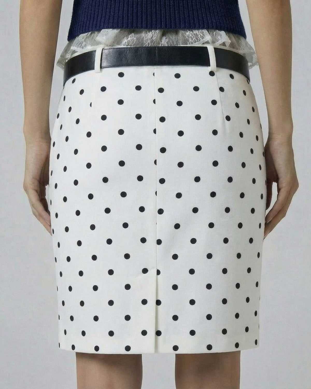 Ivory Mini Skirt by Lauven - Polka Dot Bodycon design with zip closure, showcasing a structured fit in a feminine style.
