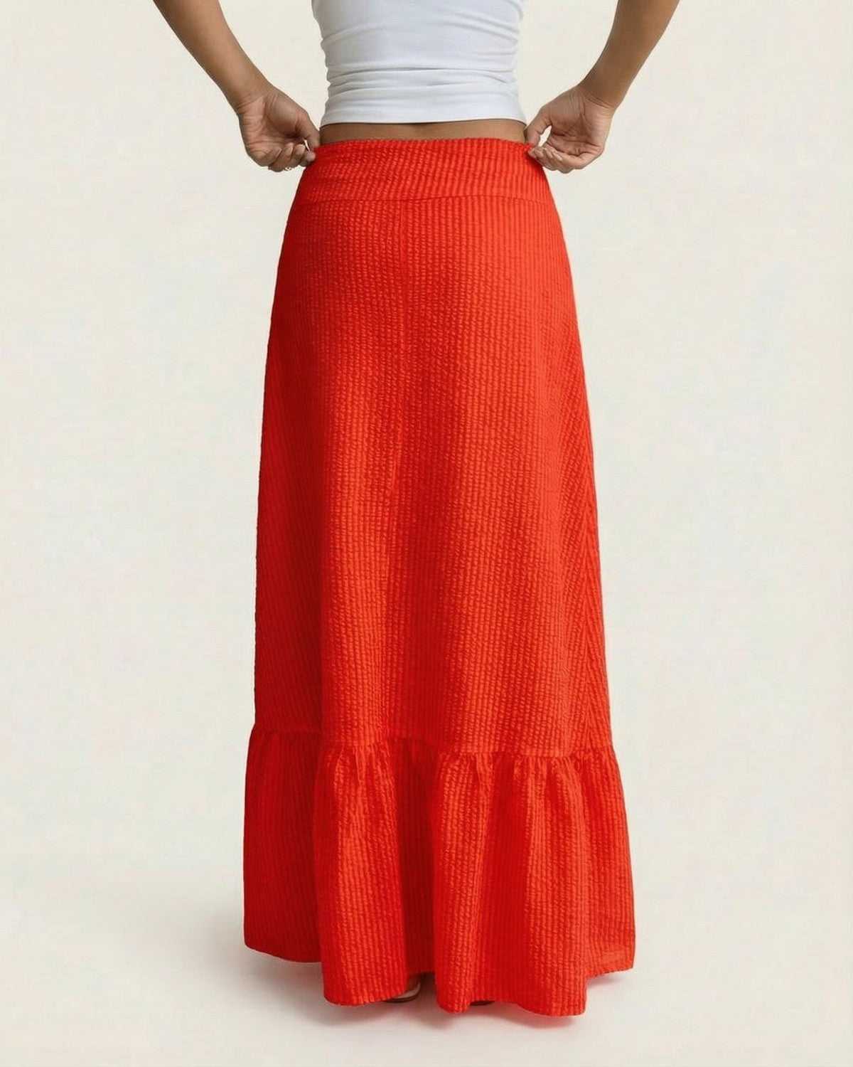 Flame Maxi Skirt by Lauven - Vibrant red flared silhouette with textured stripe finish, ideal for summer style.