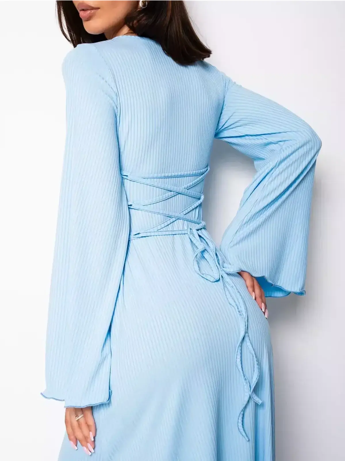 Back view of the Celeste Tieback light blue midi dress featuring long sleeves and a lace-up design.