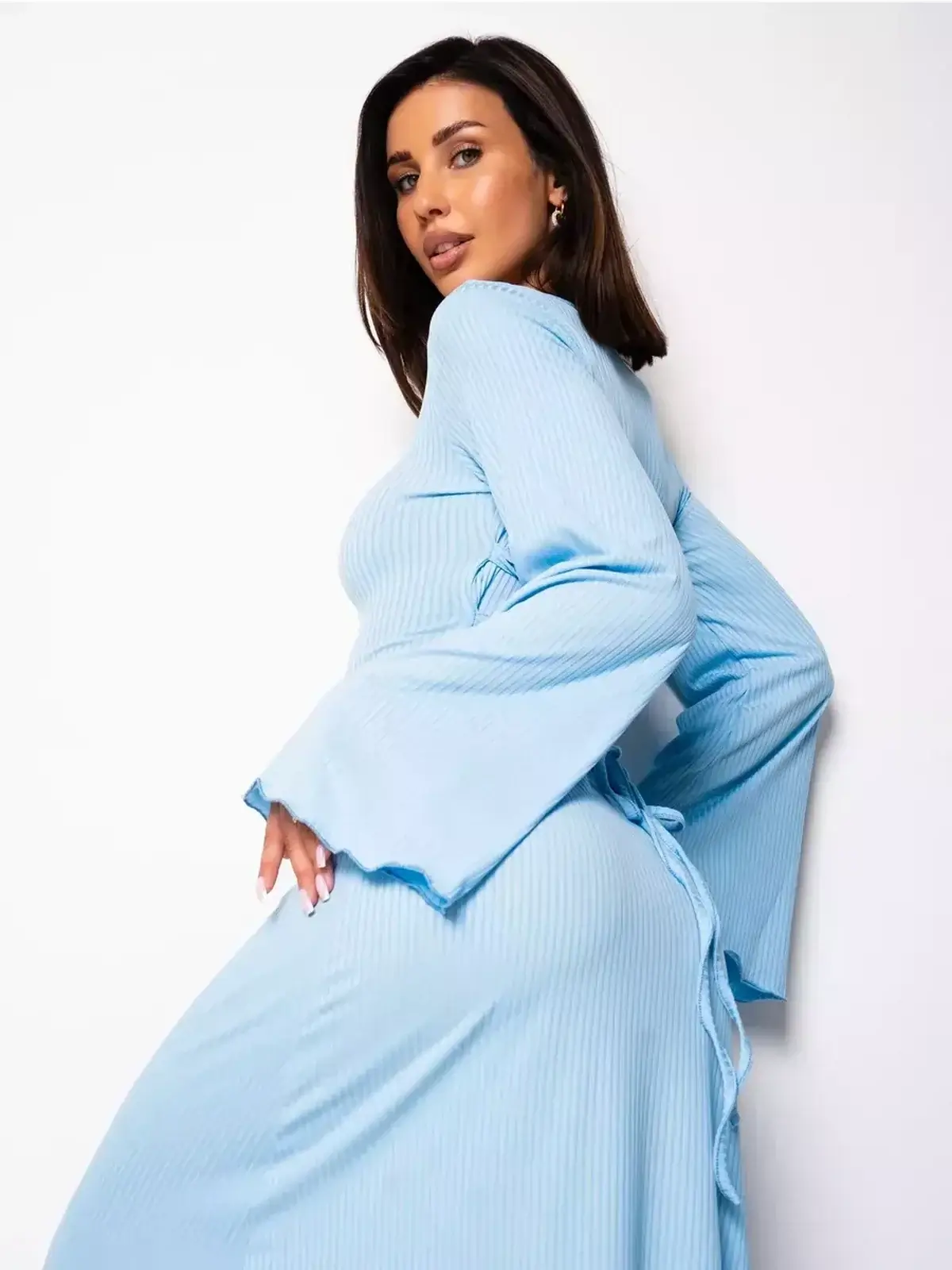 Celeste Tieback light blue midi dress showcasing long bell sleeves and a sculptural lace-up back for summer parties.