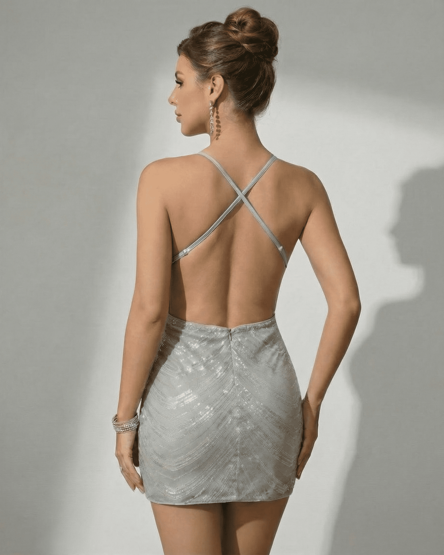 Sterling Mini Dress by Lauven featuring a stunning silver sequin design and a stylish backless silhouette.