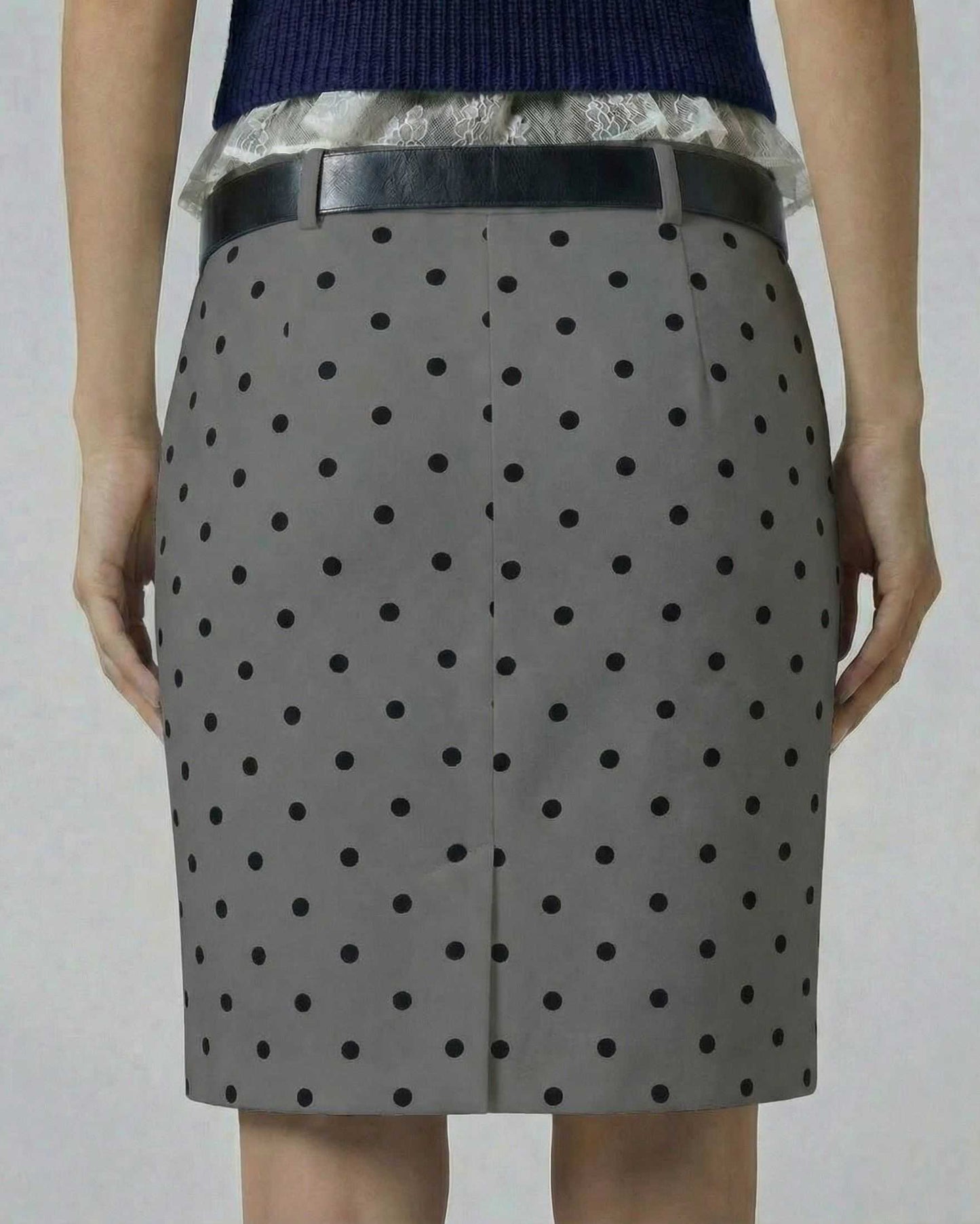 Orion Mini Skirt by Lauven in gray with black polka dots, bodycon fit, showing back view and zip detail.