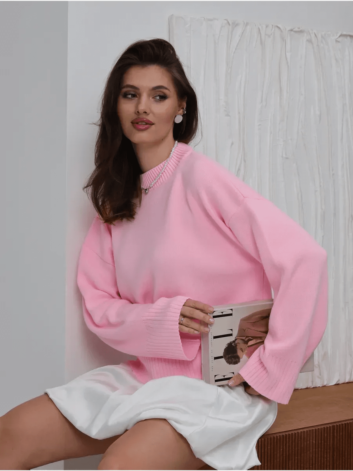 Lyra Sweater by Lauven - Oversized knit in soft pink, worn by a model, showcasing feminine charm and modern minimalism.