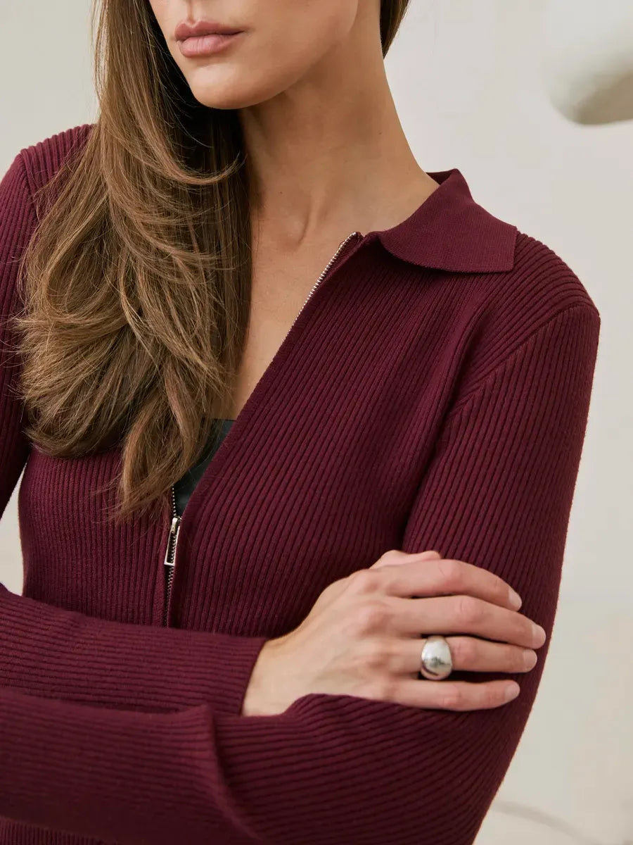 Arden Cardigan by Lauven in wine red ribbed knit with two-way zipper, showcasing a fitted silhouette.