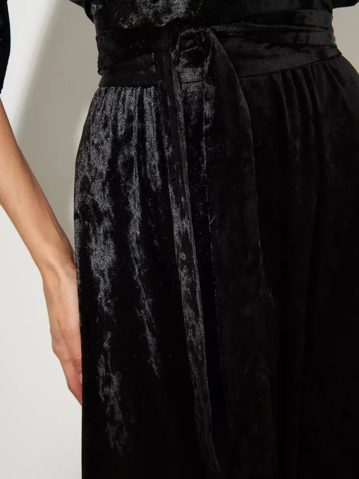 Close-up of the waist tie detail on the Noiré Maxi Dress by Lauven, featuring soft black velvet fabric.