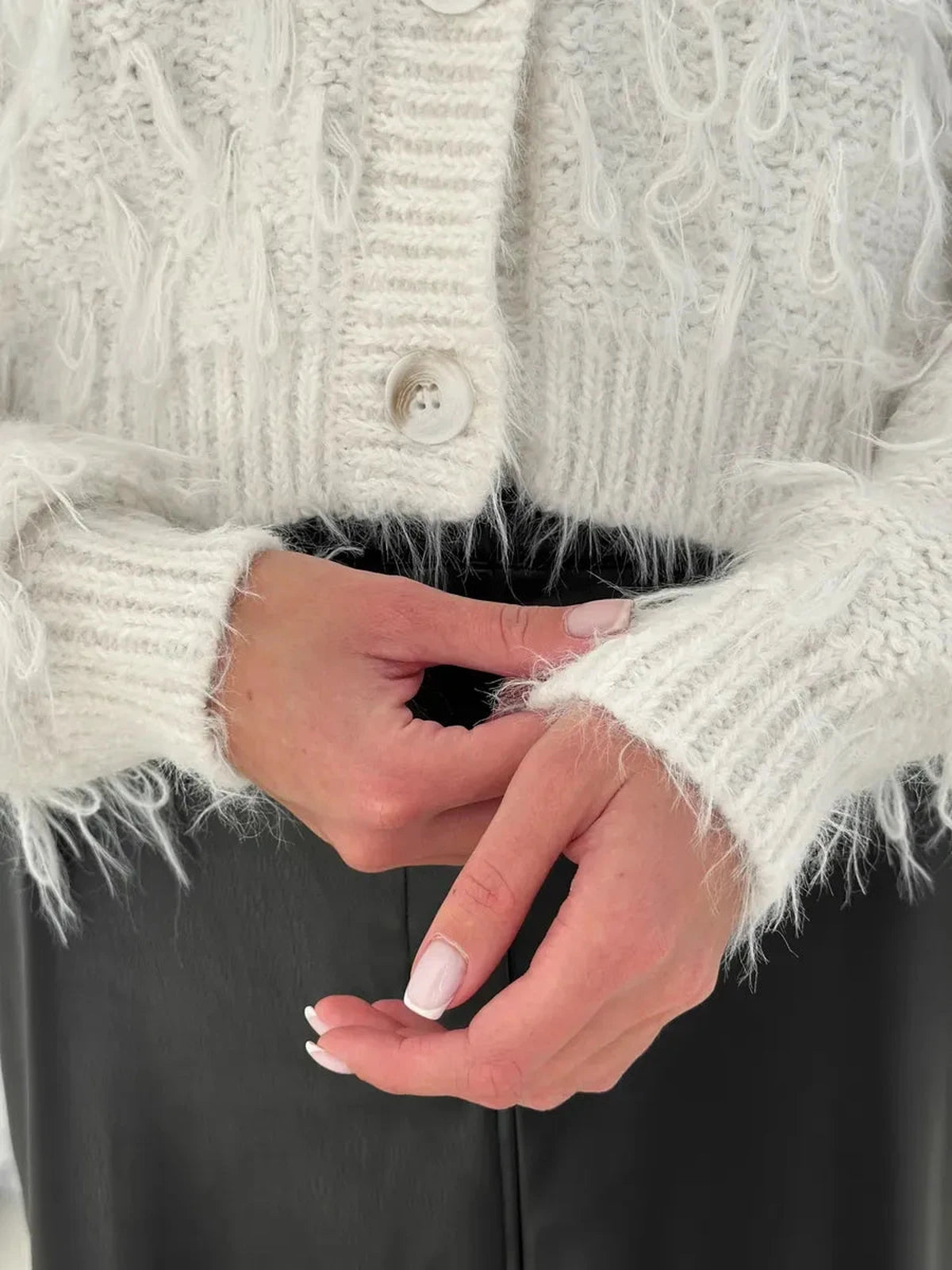 Ivory Cardigan by Lauven, featuring feathered fringe and cozy bouclé knit detail, perfect for stylish layering.