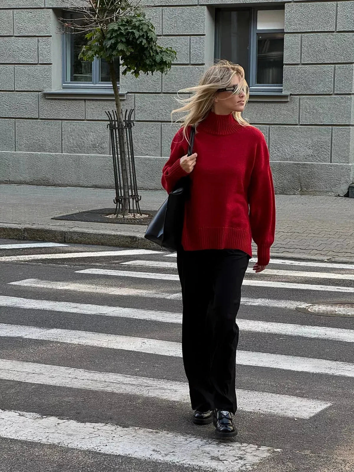 Sienna Sweater by Lauven, oversized women's knit turtleneck in deep red worn casually on the street.