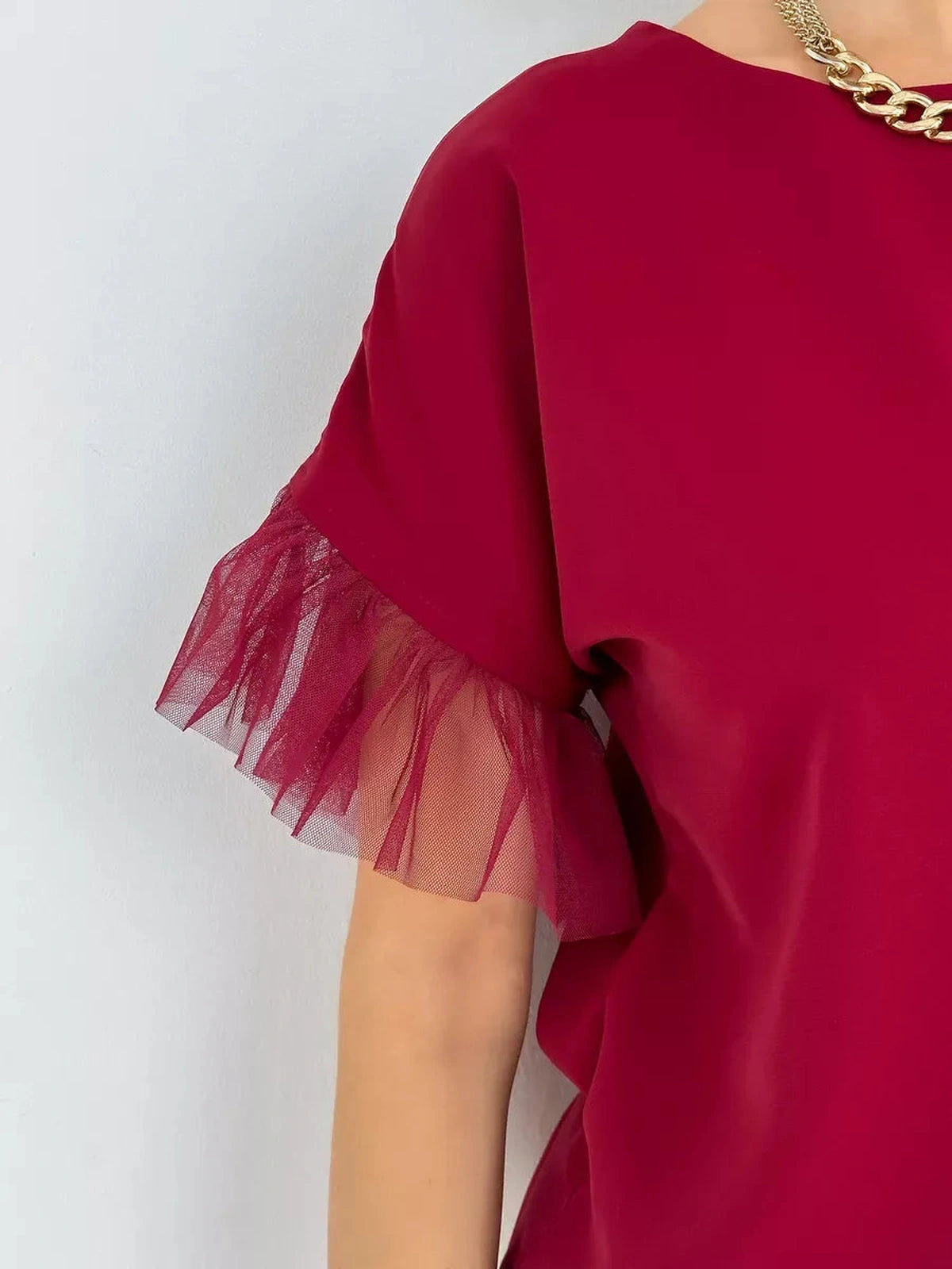Velora Blouse by Lauven — Burgundy blouse with sheer ruffle sleeves, showcasing elegance and femininity.
