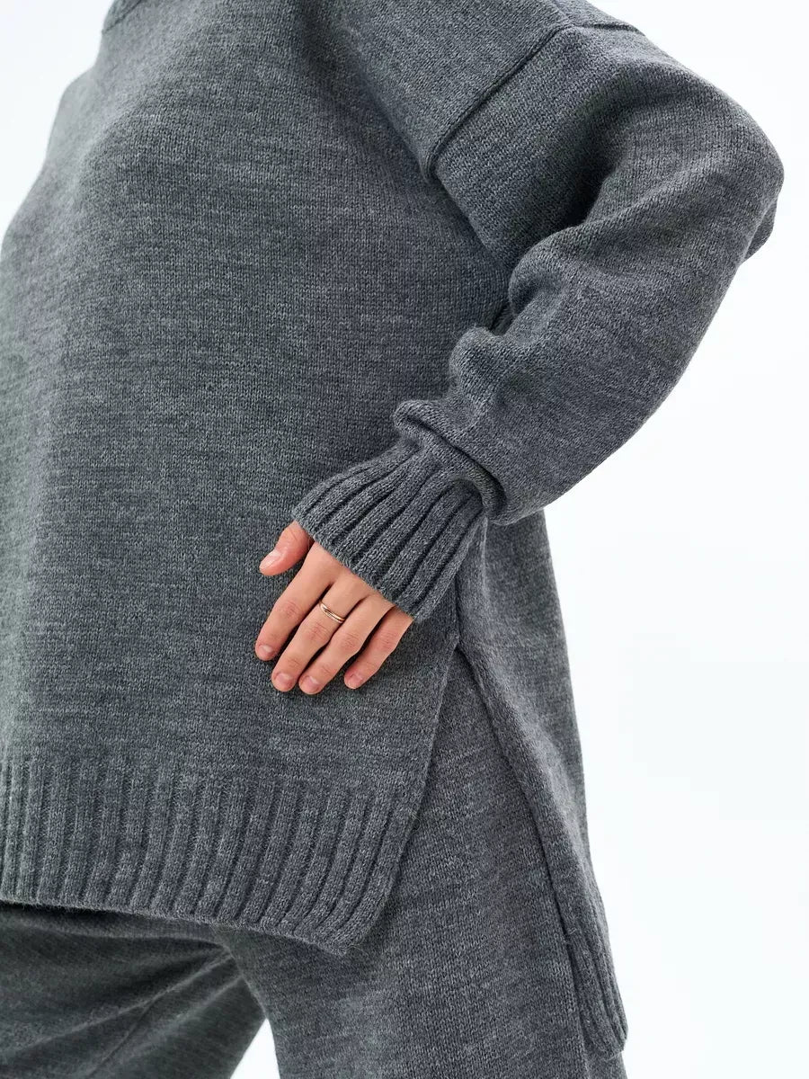 Orion Sweater by Lauven in oversized wool blend knit, showcasing a cozy graphite gray color and stylish side slit.