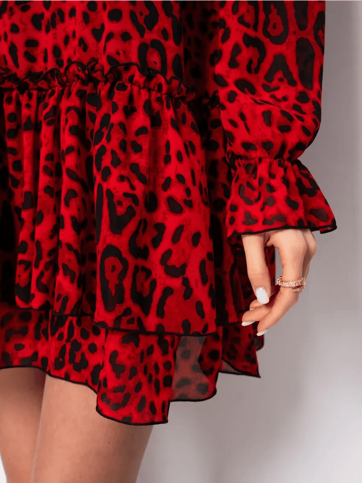 Savanna Mini Dress by Lauven, featuring red leopard chiffon fabric and a playful ruffled hem, perfect for bold elegance.
