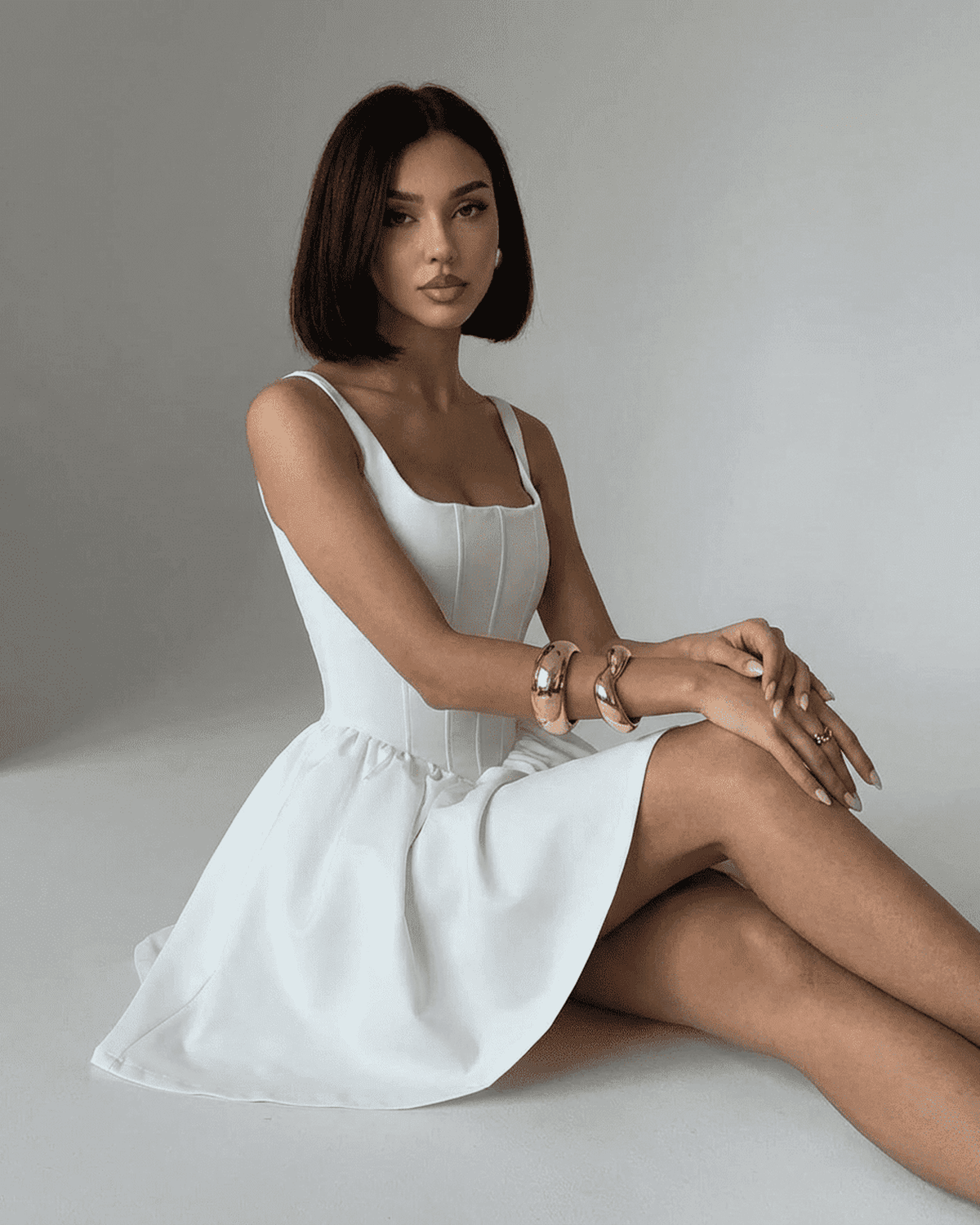 Alba Mini Dress by Lauven, pure white structured corset mini dress with square neckline, showcasing a tailored silhouette.