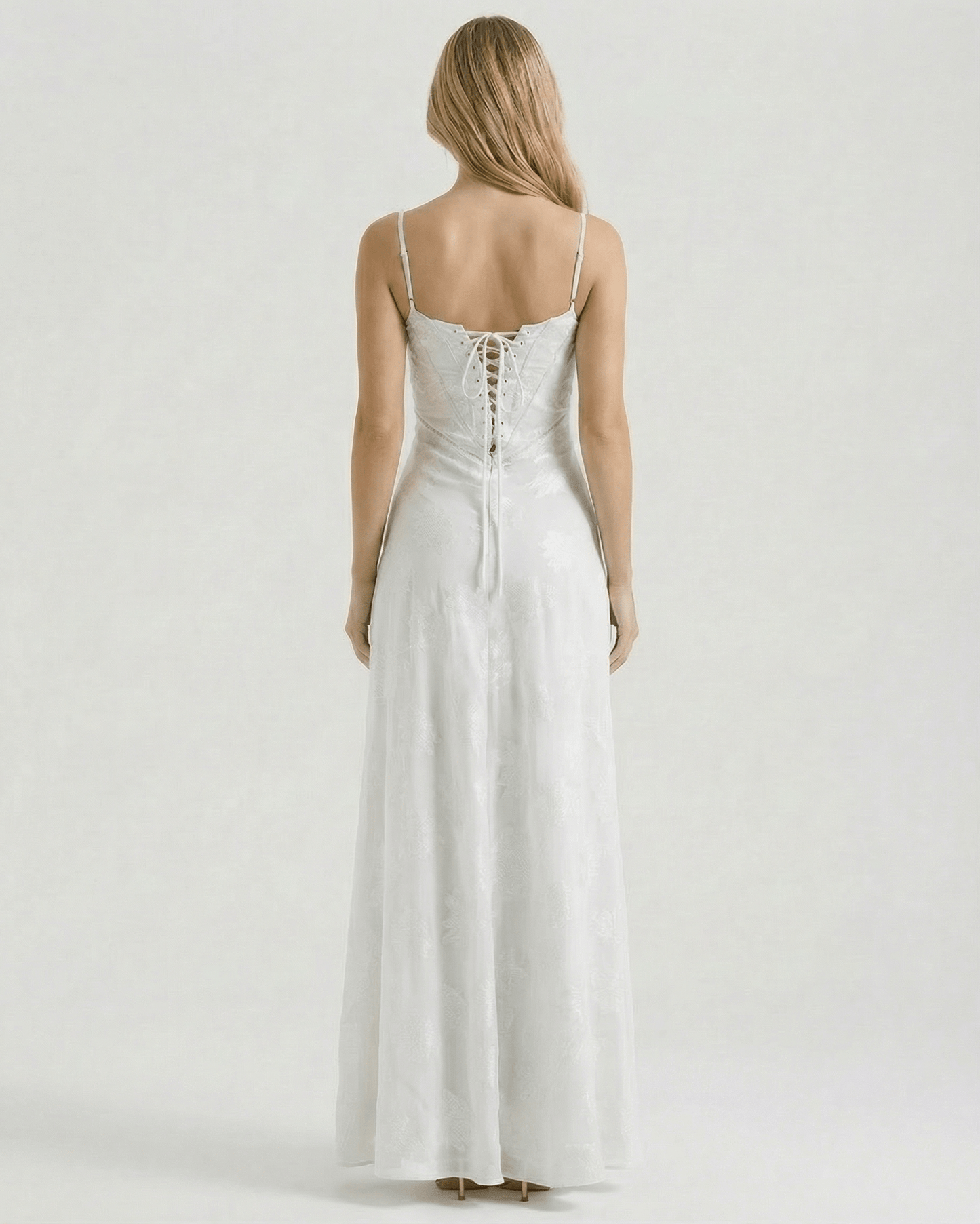 Albaea Maxi Dress by Lauven, showcasing the sheer lace-up back and elegant flowing design.