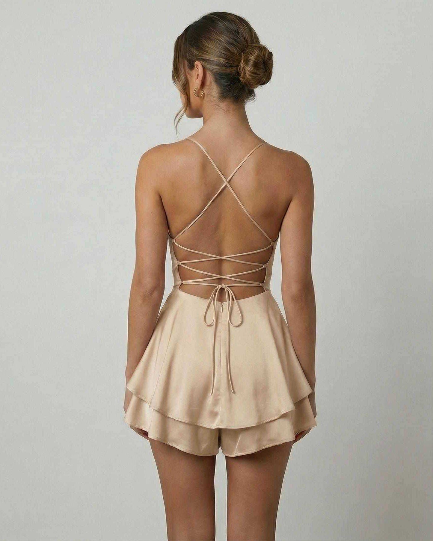 Aurielle Mini Dress by Lauven, showcasing a satin finish, open back, and elegant A-line design.