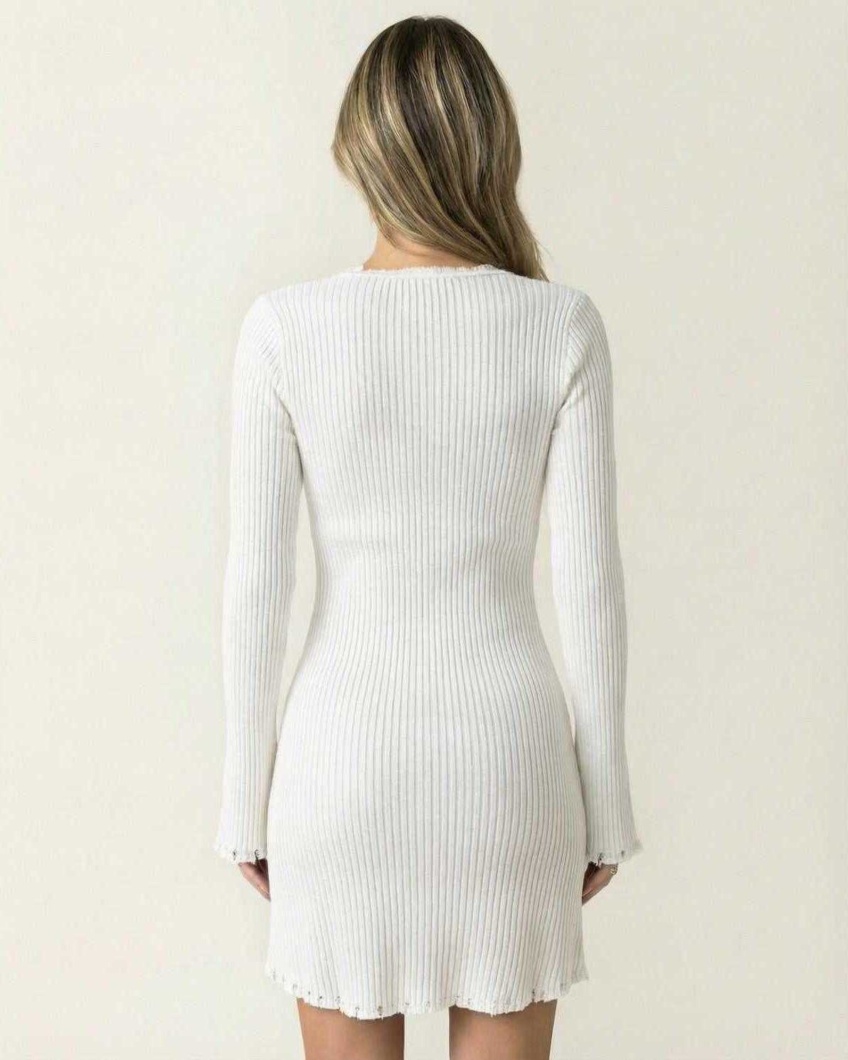 Aurora Mini Dress by Lauven - Back view showcasing the elegant ribbed design and flare sleeves in white.
