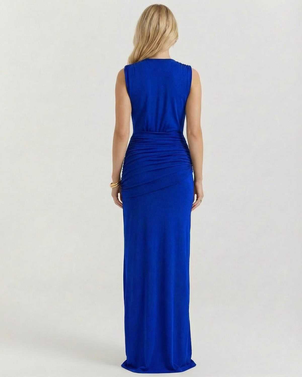 Back view of a woman wearing the Azurea Maxi Dress by Lauven, showcasing its elegant silhouette and smooth fabric.