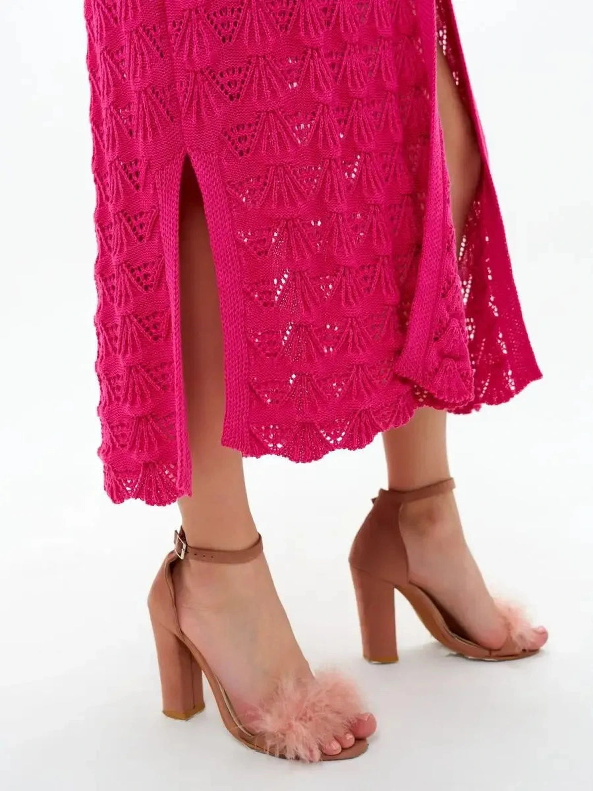 Berry Cardigan by Lauven, showcasing a vibrant raspberry openwork knit design paired with stylish sandals.