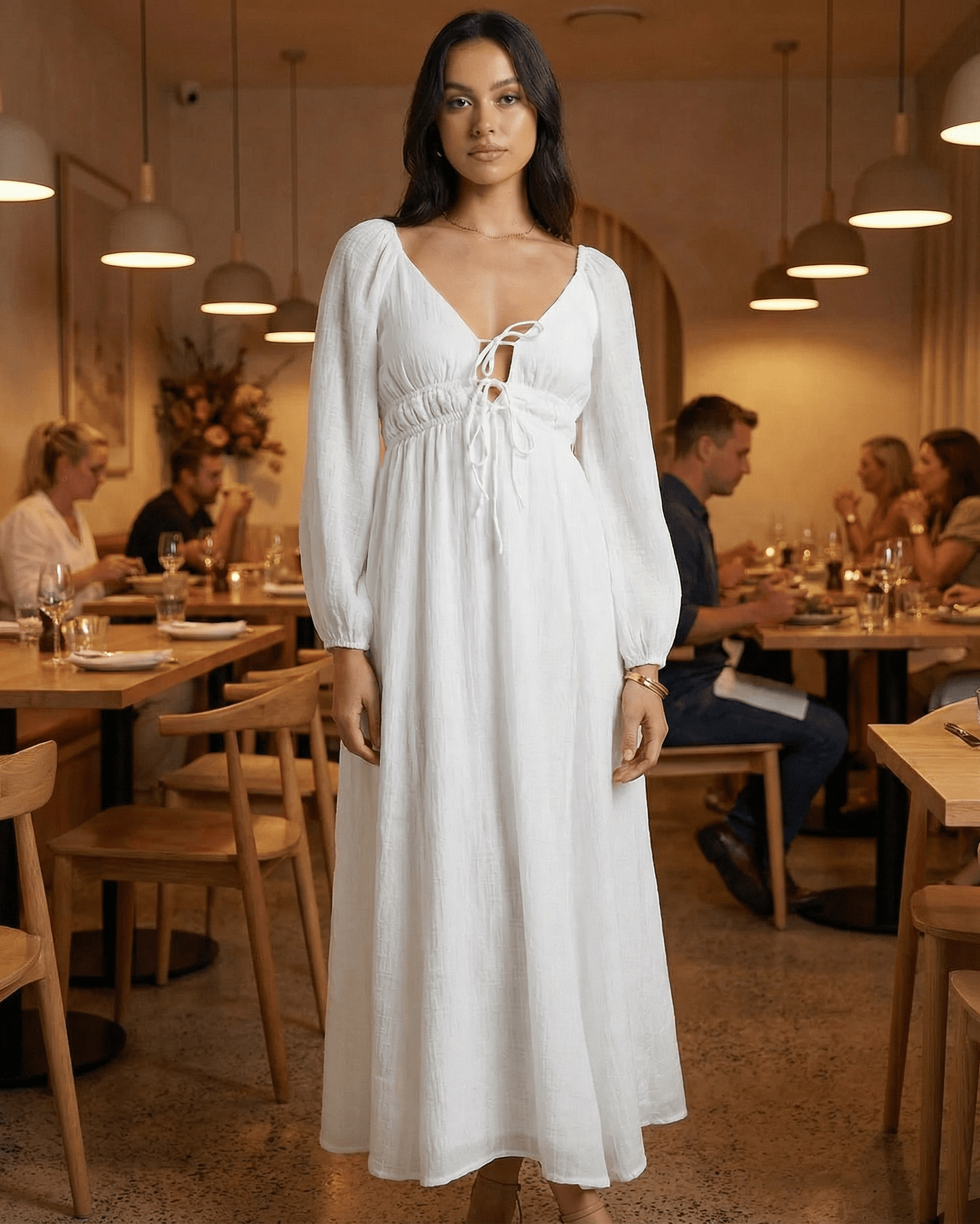 Calista Maxi Dress by Lauven, elegant white V-neck ankle-length dress styled in a restaurant setting.