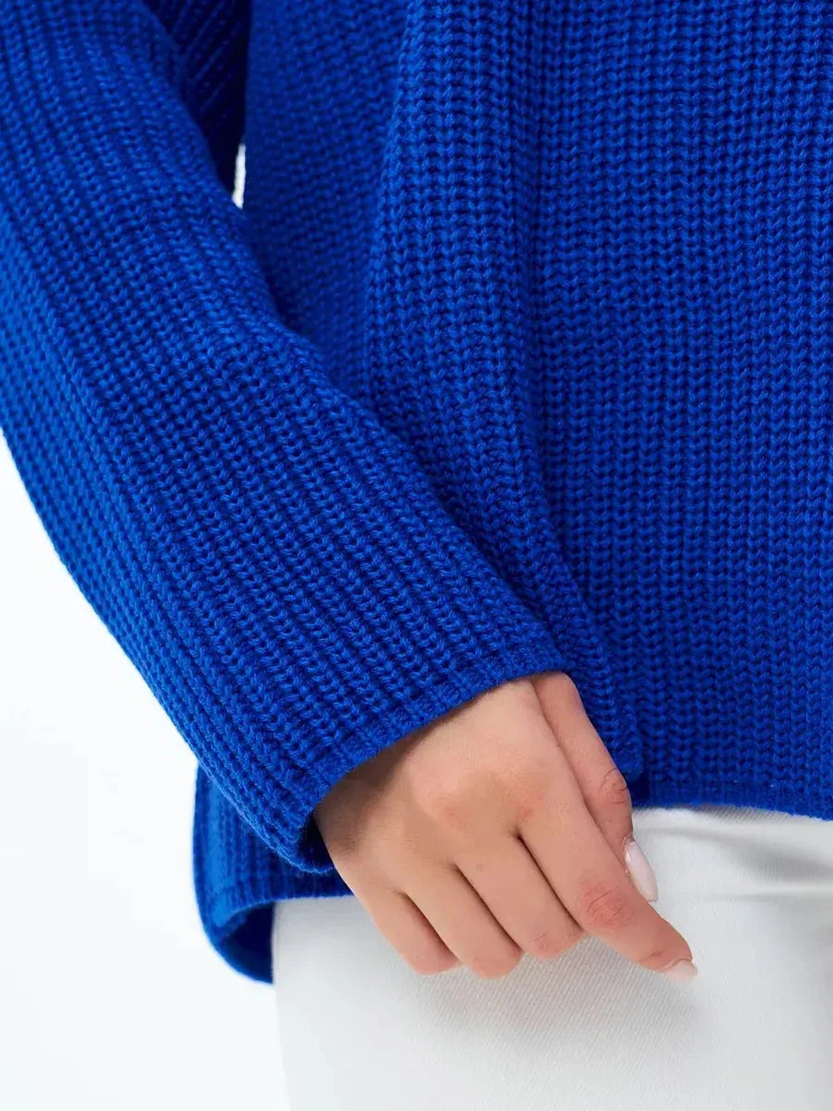 Close-up of Lauven Capri Sweater in electric blue showcasing its soft knit texture and oversized design.