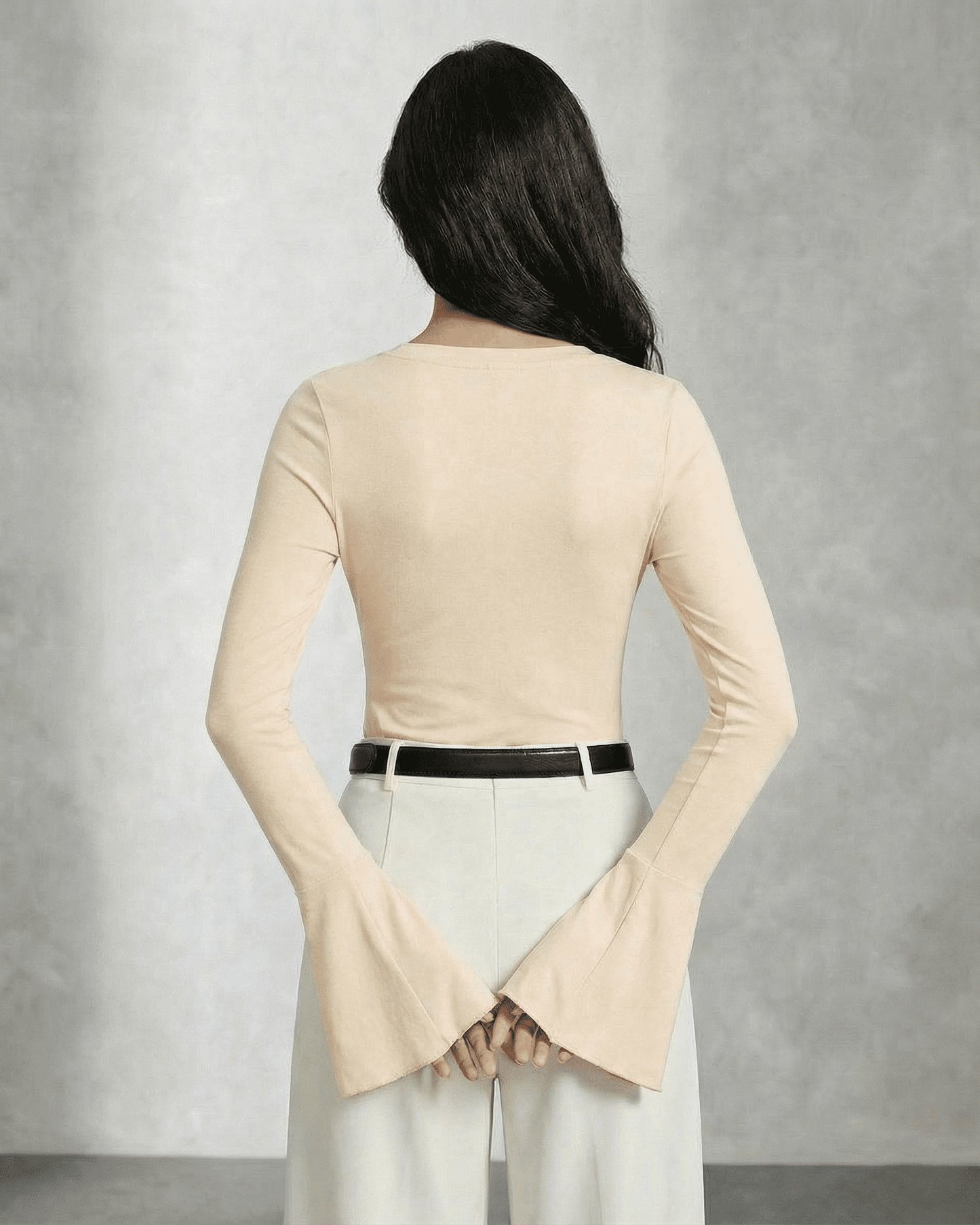 Back view of the elegant Luna Blouse by Lauven, featuring flare sleeves in a sophisticated beige hue.