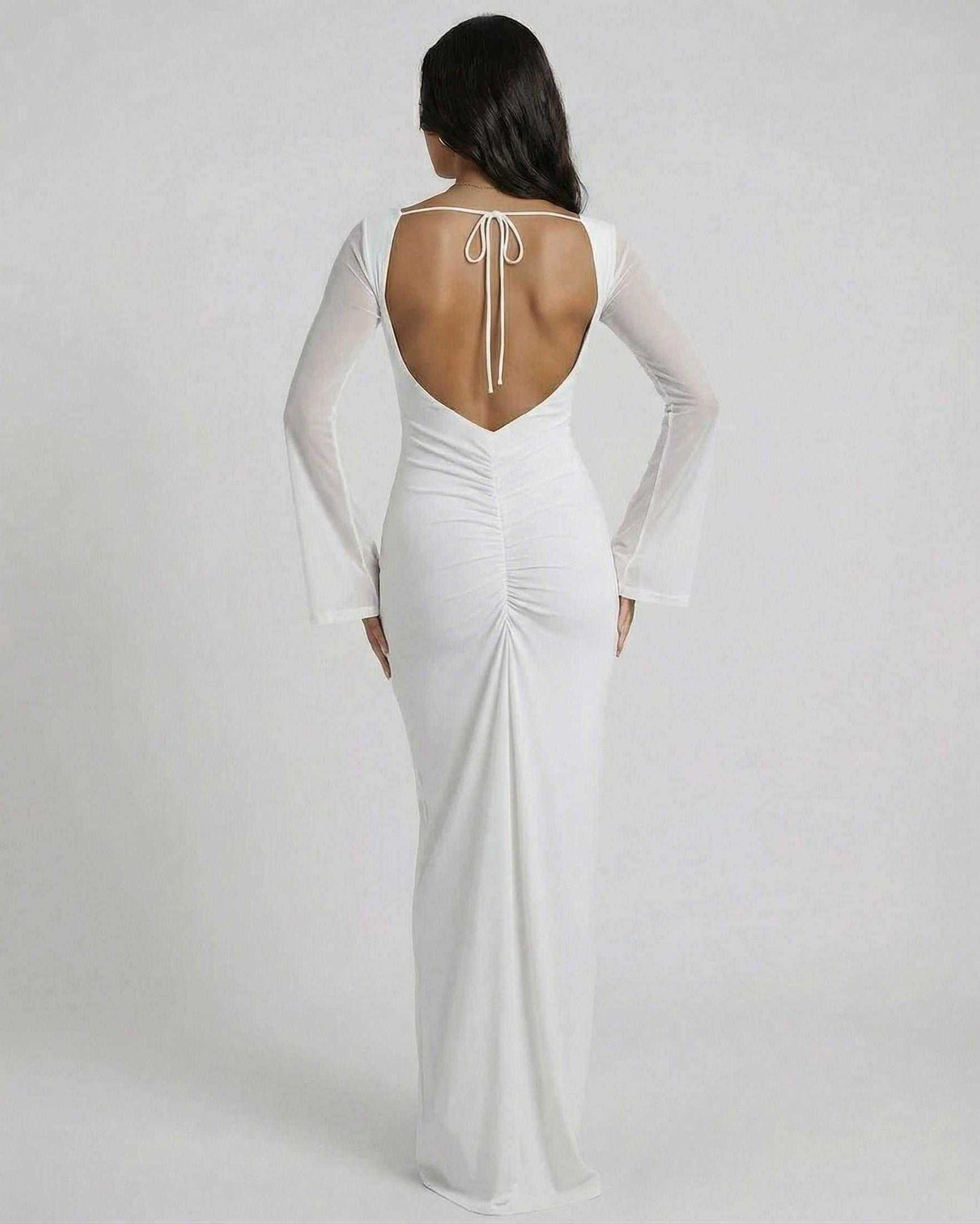 Lunaria Maxi Dress by Lauven, showcasing the elegant open back detail and sheer long sleeves.
