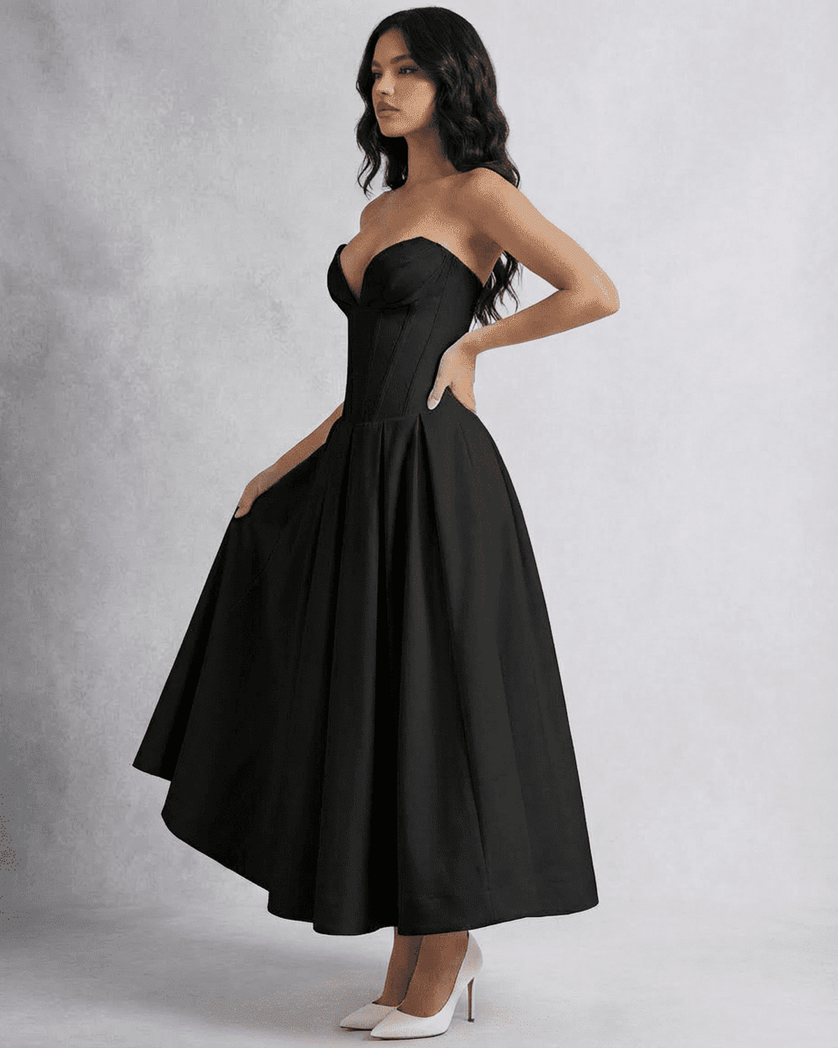 Model wearing the Nova Midi Dress by Lauven, showcasing a sleek strapless corset design and flowing A-line silhouette.