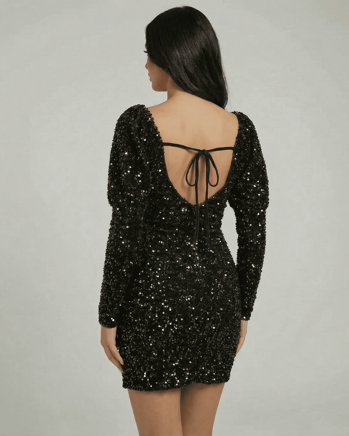 Nova Mini Dress - Lauven black sequin dress with open back, showcasing a chic and sophisticated look.