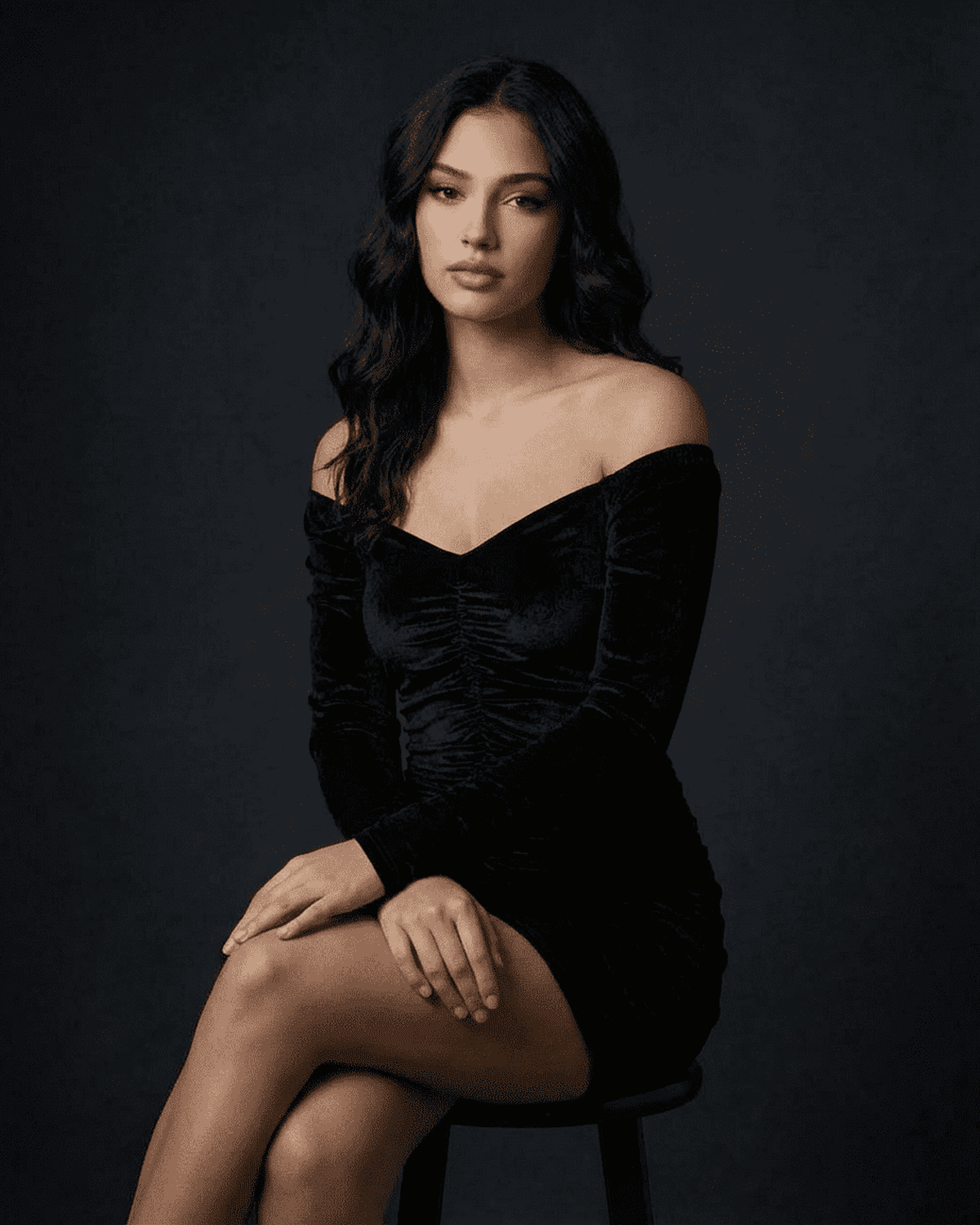 Lauven Nova Mini Dress in black velvet, showcasing a sophisticated bodycon silhouette and elegant deep V-neckline.