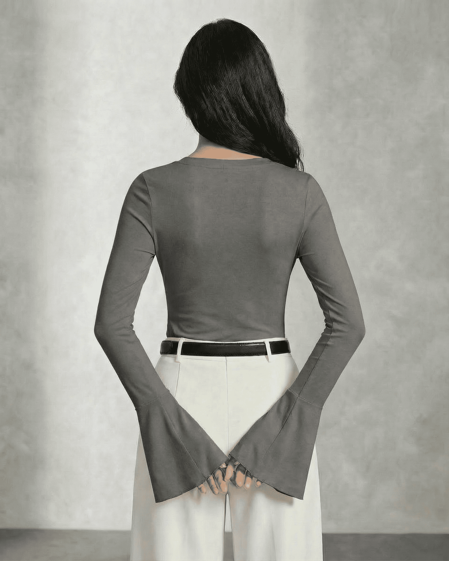 Back view of the Orion Blouse by Lauven in Modern Charcoal Gray with dramatic flare sleeves.