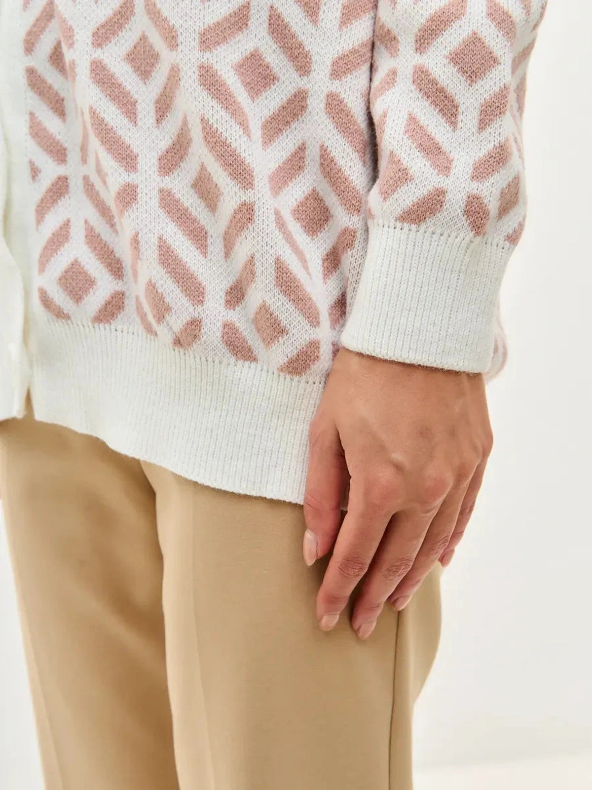 Powder Cardigan detail showcasing soft acrylic knitwear in milk and powder pink by Lauven.