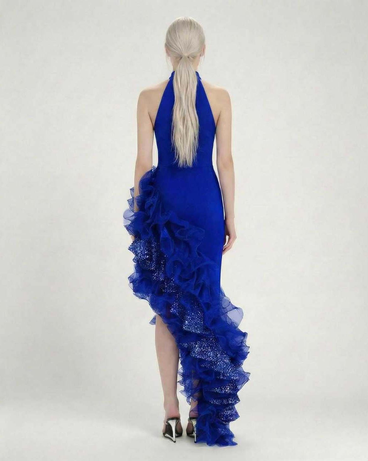 Sapphire Maxi Dress by Lauven – Back view showcasing the blue halter neck and dramatic ruffle detail.
