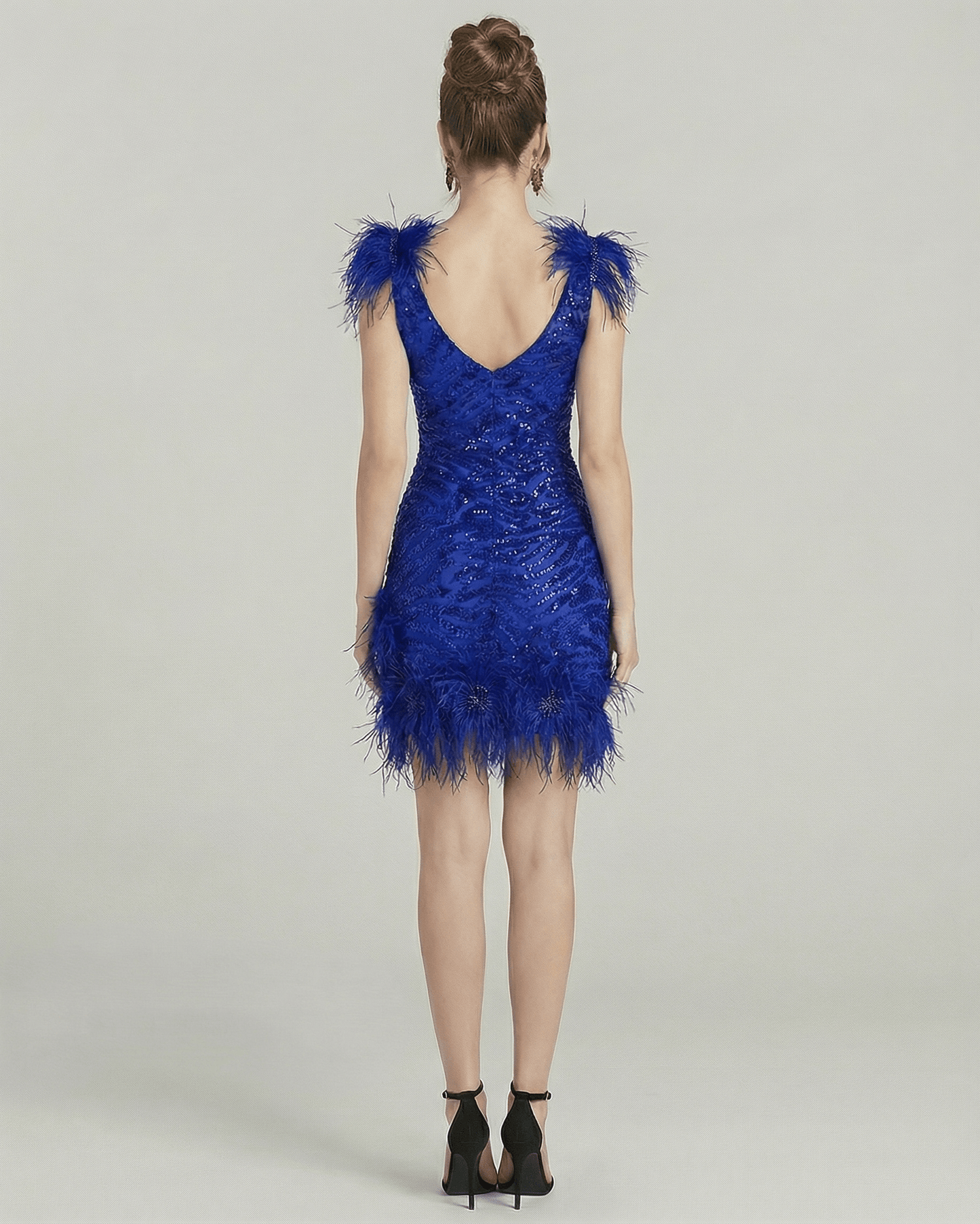 Back view of the Lauven Sapphire Mini Dress featuring feathered embellishments and sequin detailing.