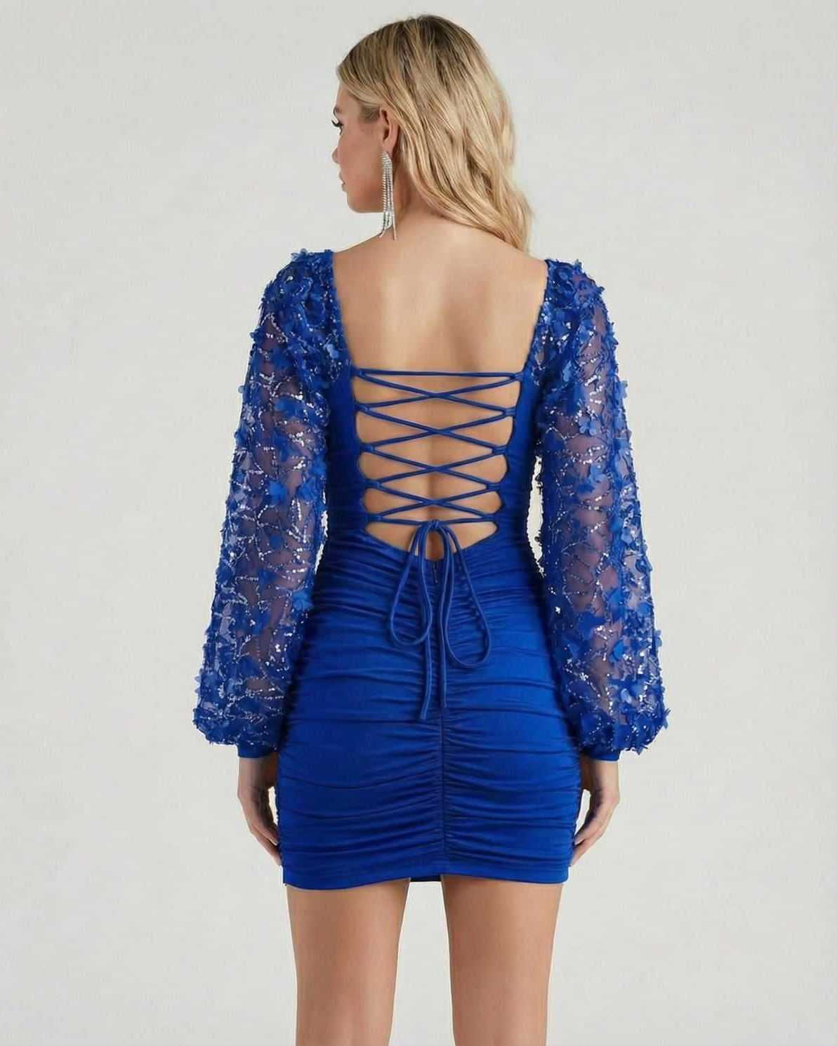 Sapphire Mini Dress by Lauven showcasing a stunning lace sleeve design and body ruching, highlighted in striking blue.