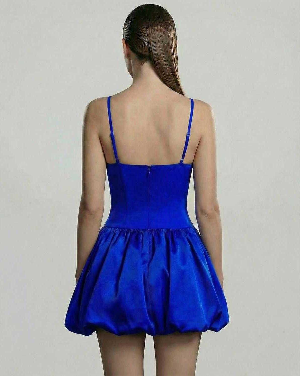 Back view of the Lauven Sapphire Mini Dress, featuring a structured V-neck and voluminous puff skirt.