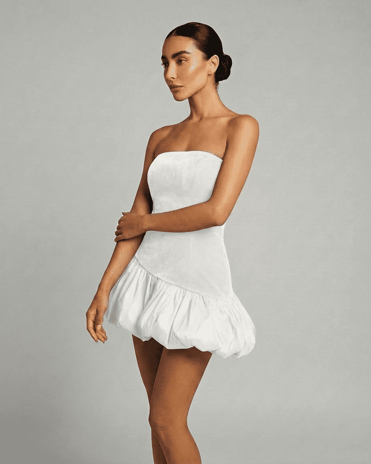 Selina White Dress by Lauven, featuring a strapless design and a puffed mini skirt in luxurious velvet.