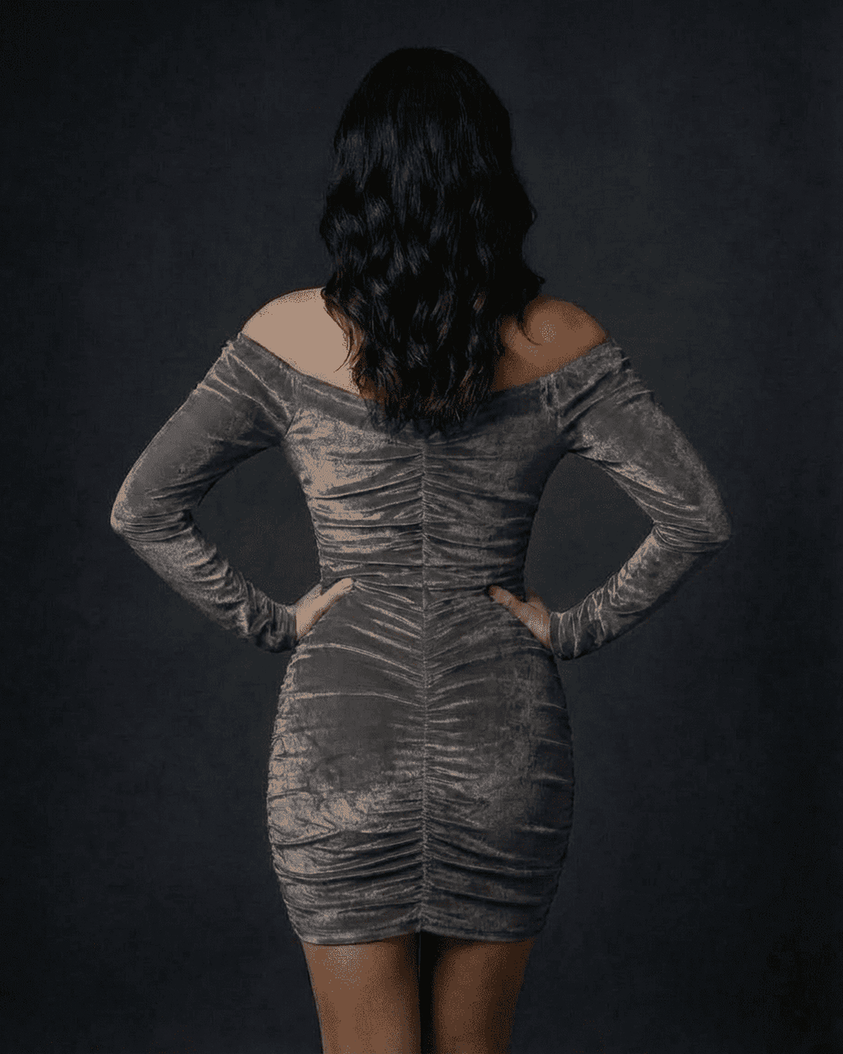Back view of Lauven Slate Mini Dress in ruched velvet, showcasing off-the-shoulder neckline and bodycon fit.