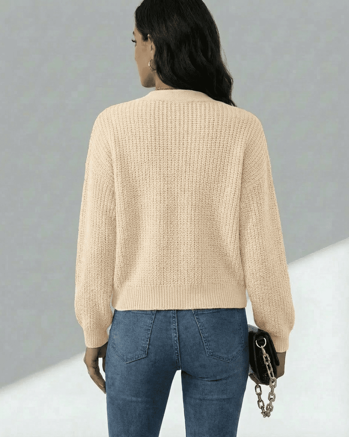 Back view of a model wearing the Lauven Solene Cardigan, showcasing its soft knit texture and casual style.