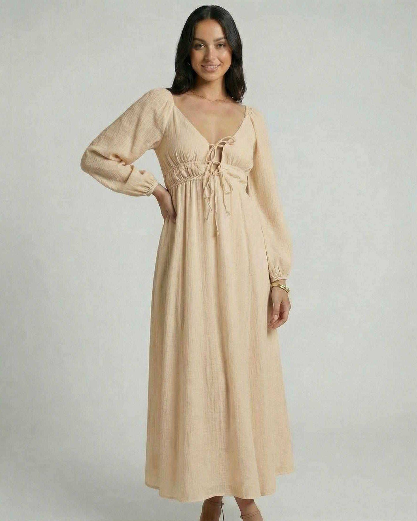 Solenne Maxi Dress by Lauven in beige, featuring a V-neck, empire waist, and ankle-length silhouette.