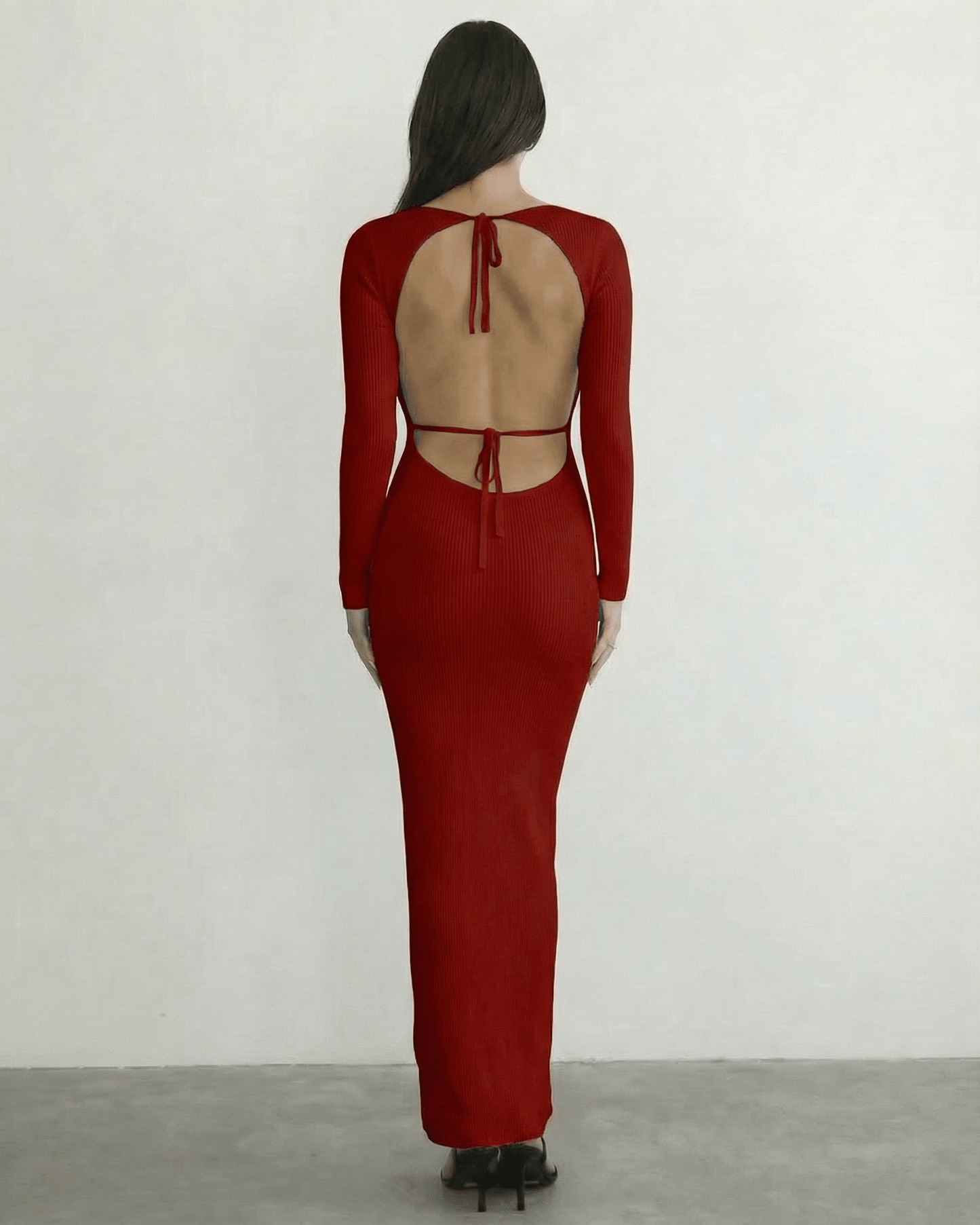 Valencia Maxi Dress by Lauven - back view of a red ribbed knit long sleeve maxi dress with open back tie detail.