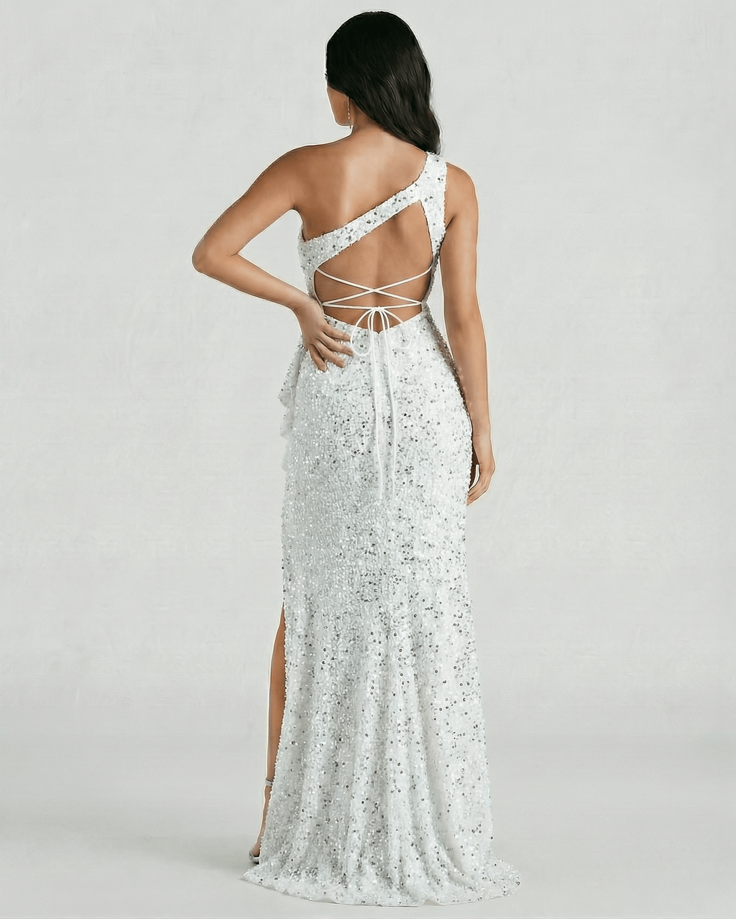 Valencia Maxi Dress by Lauven – Back view of white sequin one shoulder dress with high slit and elegant design.