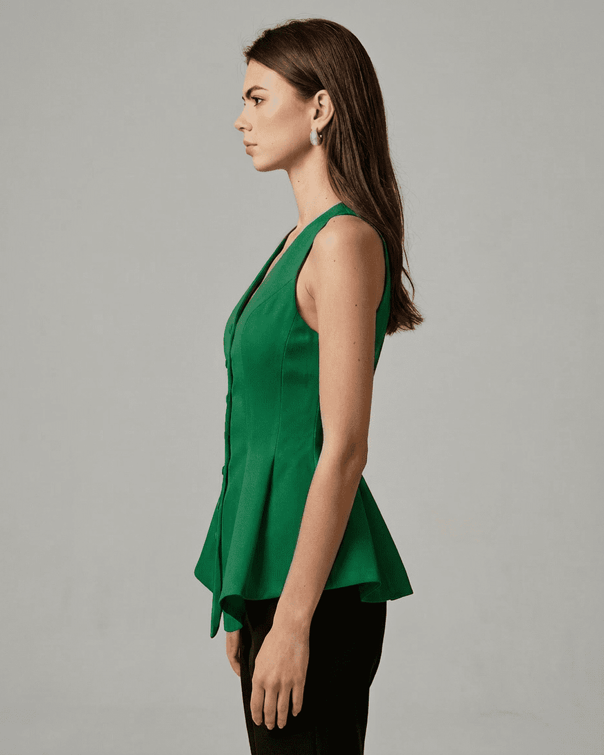 Verona Blouse in elegant green from Lauven, showcasing a tailored sleeveless V-neck design for sophisticated styling.