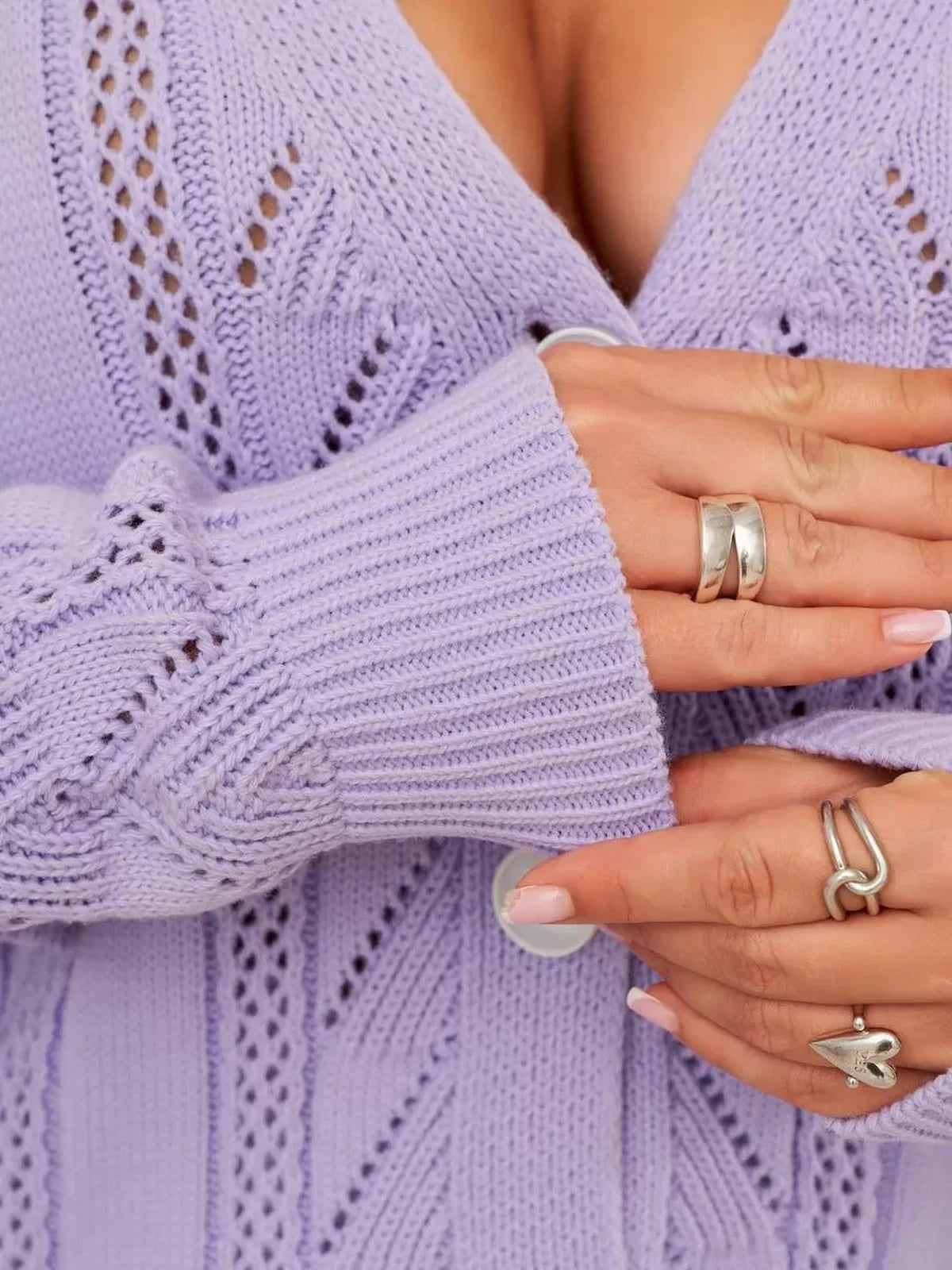 Lavina Cardigan by Lauven showcasing long lavender knit with ruffles and button closure.