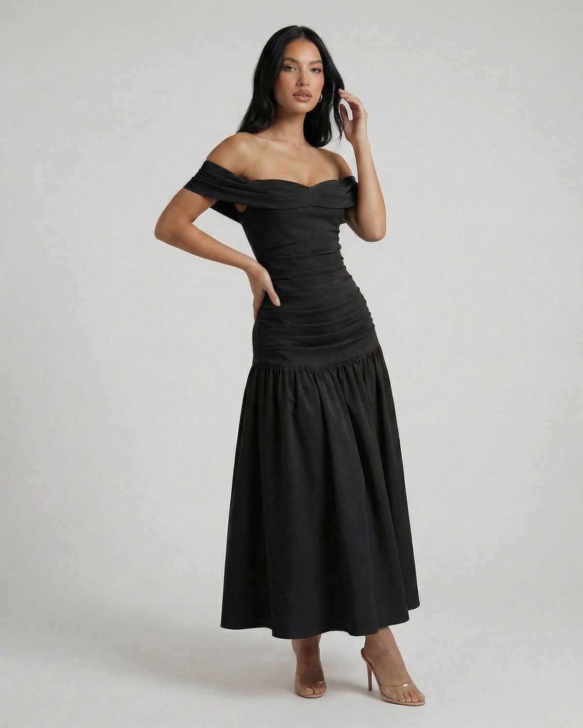 Vesper Midi Dress by Lauven, showcasing sleek off-shoulder black elegance in a modern silhouette.