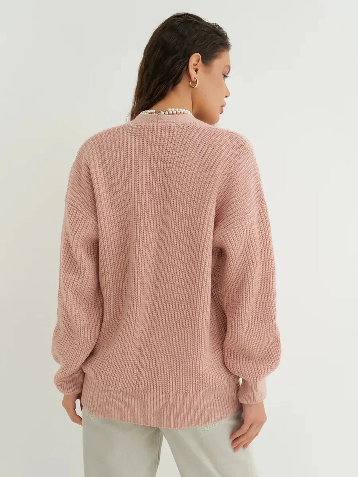 Liora Cardigan by Lauven in soft powder pink, showcasing oversized knitwear design from the back.