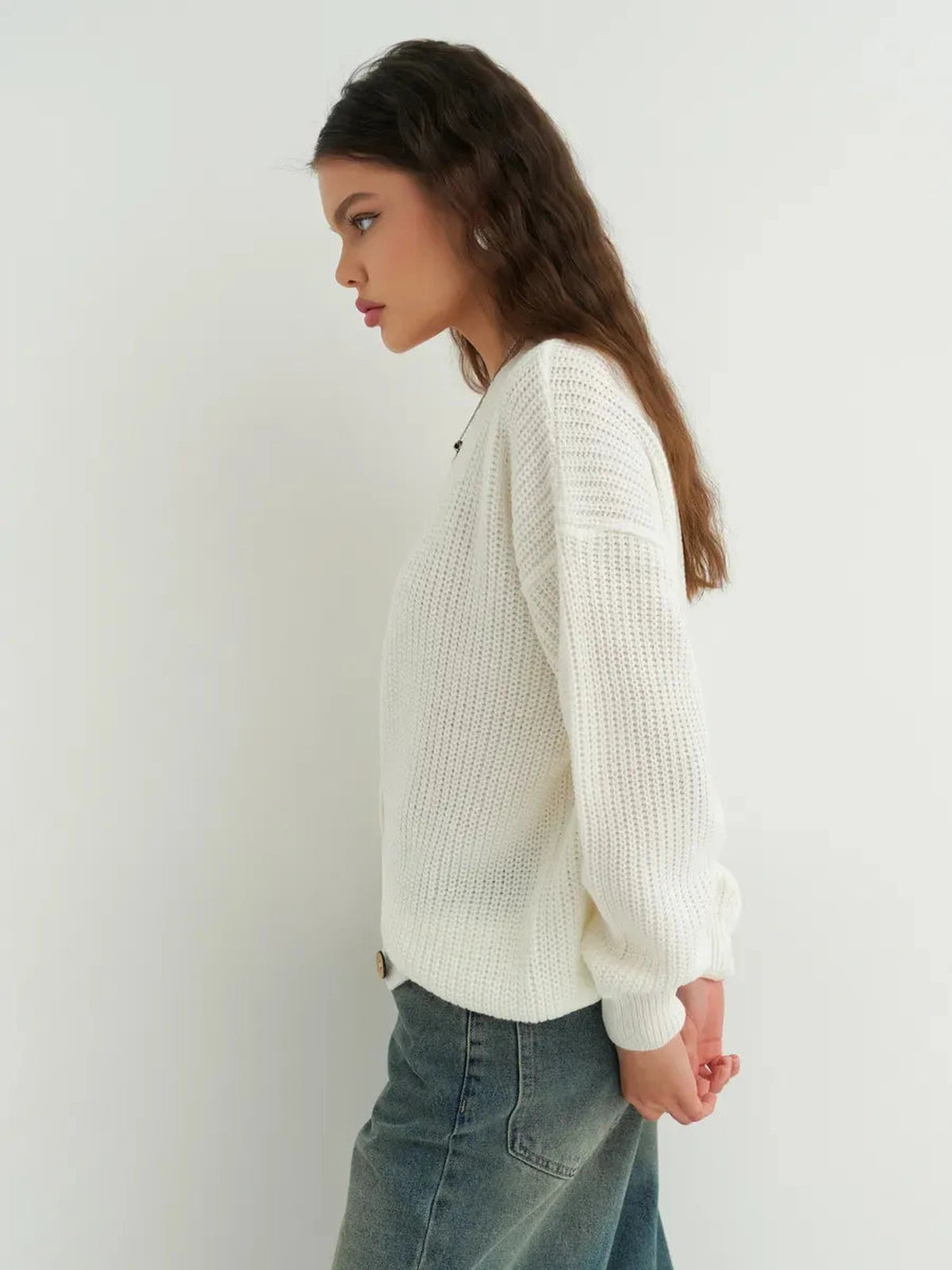 Noelle Cardigan by Lauven, an elegant white knitwear piece with button detailing and an oversized silhouette.