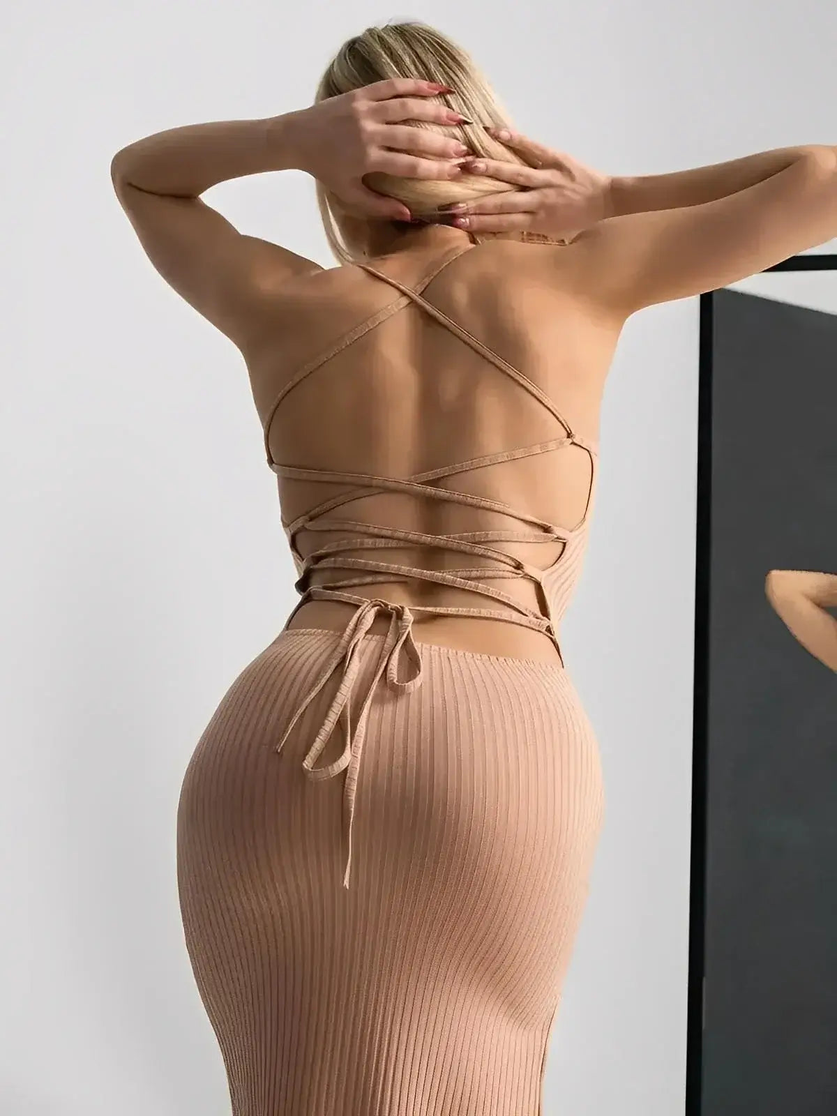 Nude Lace Midi Dress by Lauven showing back view with corset lace-up detailing and ribbed fit.