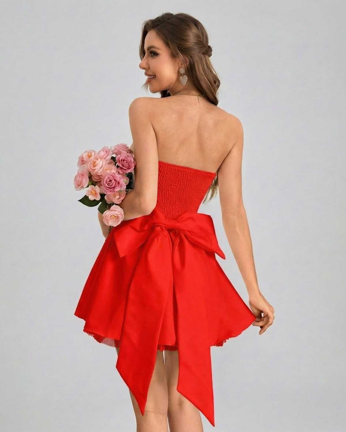 Rubina Mini Dress by Lauven, strapless red mini dress with bow detail and flared skirt.
